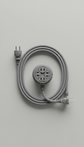 A perfectly centered Eco Power extension cord on a neutral Eco Gray background, shot straight-on with a 50mm lens. The...